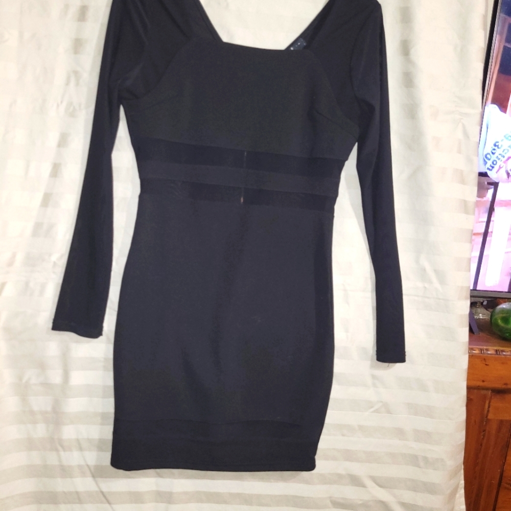 This is a eye catching Dress by Honey Peach. True Black with sheer stripes